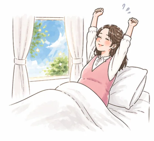 朝、ベッドで気持ちよく伸びをする妊婦さん