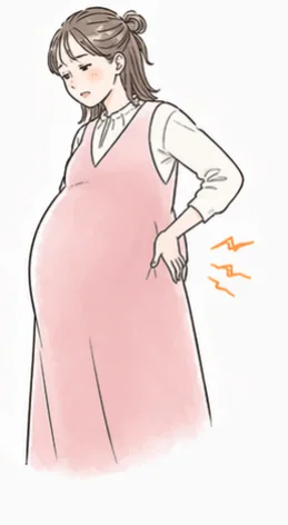 腰に手を当てる妊婦さん