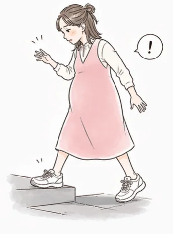 段差を気にしながら歩く妊婦さん